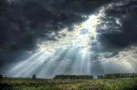 Beams of light coming through dark clouds...something about it is ...