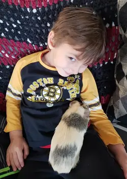 Brayden holding Sunshine.webp Brayden holding Sunshine.webp